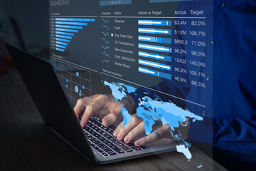 Manager analyzing business analytics dashboard with operations and sales metrics on computer. Late night overtime in office. Key performance indicators showing insightful data for corporate strategy