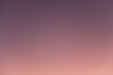 sunset and the moon in the sky 