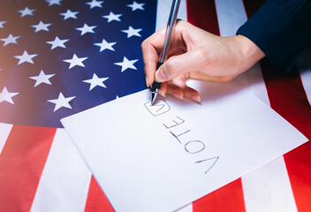 Woman putting tick on the paper for vote. Political changes in the country. Copy space place....