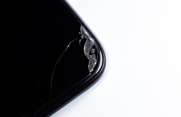 Broken phone close up photo. Damaged smartphone. Crashed glass.
