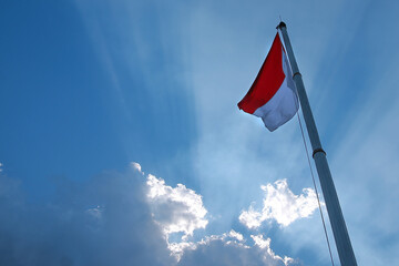 Indonesian flag fluttering in the beautiful sky