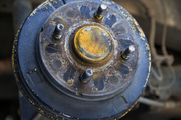 A rear hub of the car after removing a tire and wheel, maintaining a brake and wheel system, car jack-up for change a car wheel, Close-up shot