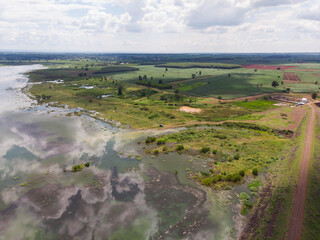 Naklejka premium Drone shot aerial view scenic landscape of river reservoir dam and the forest