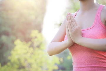 Beautiful girl is playing yoga at the park. In the midst of nature Exercise concept