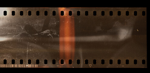 real scan of empty or blank 35mm negative film strip with dust and scratches, high res scan.
