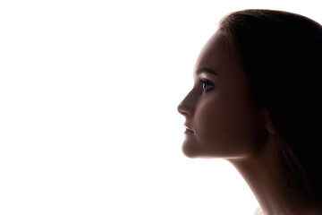 Fototapeta premium Facial enhancement. Beauty procedure. Profile portrait of woman silhouette isolated on white copy space background. Plastic surgery. Skin correction. Lip plump. Collagen injection.