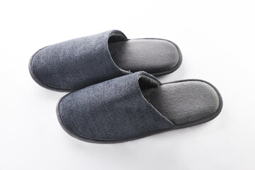 Pair of blank soft gray home slippers, design mockup. Hotel bath slippers top view isolated on white background. Clear warm domestic sandal or sneakers. Bed shoes accessory footwear.