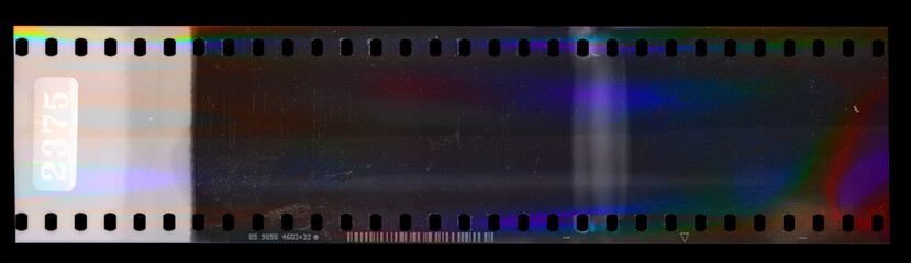 nice scan of long empty 35mm negative filmstrip with cool scanning light interferences.