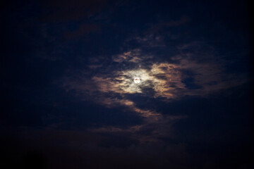 Full moon and black clouds