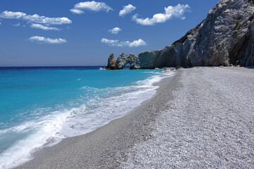 Fototapeta na wymiar Paradise beach of Lalaria in Skiathos island on a slight cloudy morning, Sporades, Greece