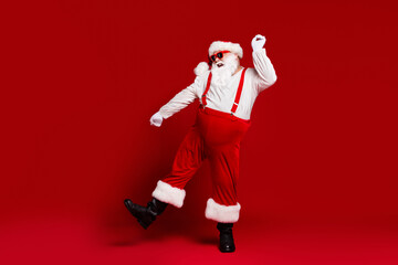 Fototapeta na wymiar Full length body size view of his he attractive cheerful cheery carefree funny fat white-haired Santa dancing having fun club isolated bright vivid shine vibrant red burgundy maroon color background