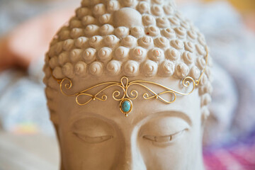 Brass tiara with gemstone on Buddha statue head
