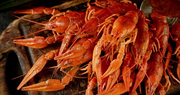 Boiled crayfish on the cutting board rotate. 