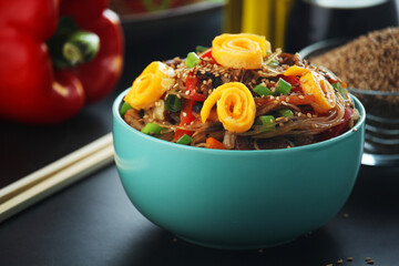 Japchae, a sweet and savory dish of stir-fried glass noodles, Korean cuisine