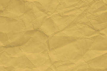 Paper beige color aged and wrinkled. Background of brown color with kinks and fraying.