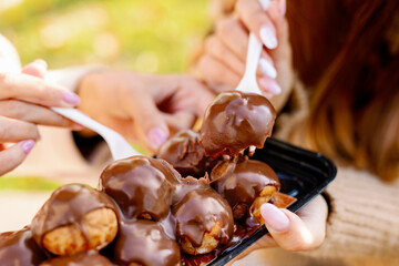 sweet dessert eaten outside with forks in the park
