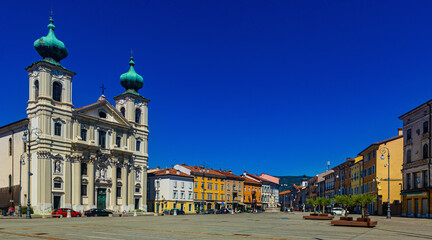Imposing building of Church of St. Ignatius with two bell towers on Victory Square (Piazza della Vittoria) on sunny autumn day, Gorizia, Italy - obrazy, fototapety, plakaty