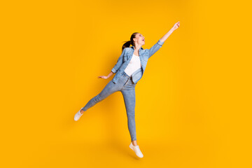 Full length body size view of her she nice attractive glad cheerful cheery girl jumping strolling holding invisible parasol forecast isolated bright vivid shine vibrant yellow color background © deagreez