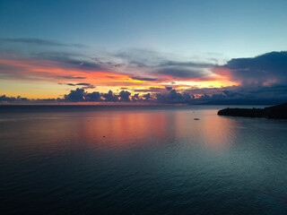 An aerial view of the beautiful sunset captured on top of a beach resort 