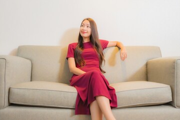 Portrait beautiful young asian woman relax on sofa in living room