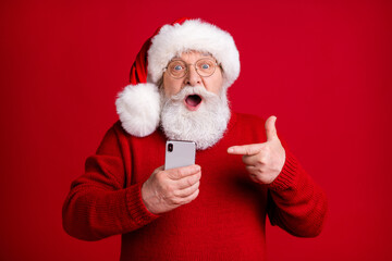 Amazed grey beard old man use smartphone point index finger browse magic miracle holly jolly x-mas...