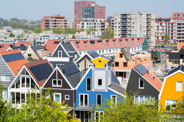 Many beautiful Dutch modern colorful houses in the daylight. One of the Dutch modern cities with its specific architecture. Zaandam in the 2020 year