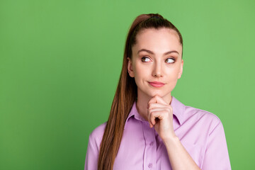 Portrait of curious interested girl look copyspace touch finger chin think thoughts plan decide decisions wear violet purple clothes isolated over green color background