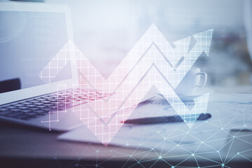 Computer on desktop with point up arrows hologram. Double exposure. Concept of success.