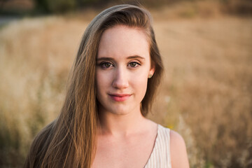 Naklejka premium Portrait of a beautiful blonde close up. Gorgeous girl looking at camera background selective focus