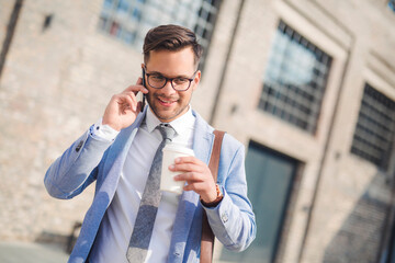 Stylish young man talking on mobile phone