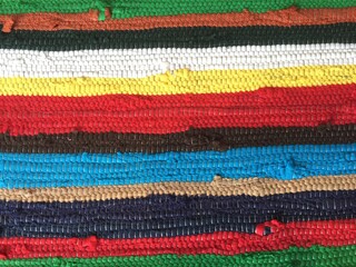 Obraz premium rug blanket made of woven rag background backdrop stripes texture these style of blankets and rugs are made of old textile