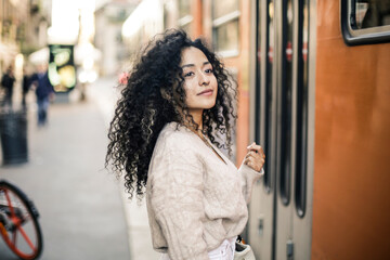 Young woman is waiting a tram