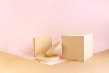 Abstract empty podium of geometric shape on pastel background for product. Beige cube with circle stands on light brown and pink backdrop. Pedestal template. Minimal concept. Mock up.