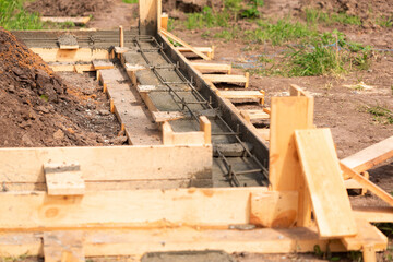 Lay of the cement or concrete into the foundation formwork with automatic pump