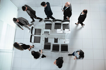 top view. a group of business people goes to the conference room