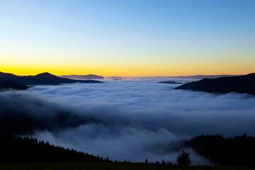 Fototapeta na wymiar Majestic sunrise in the mountains landscape, beautiful dawn with fog