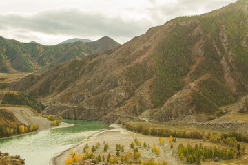 Mountain river between high mountain ranges.