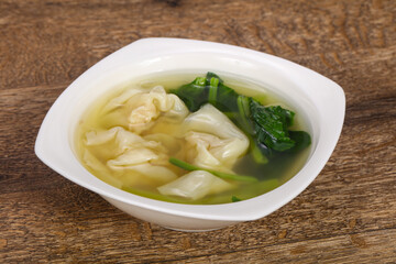 Asian traditional Wonton soup with herbs