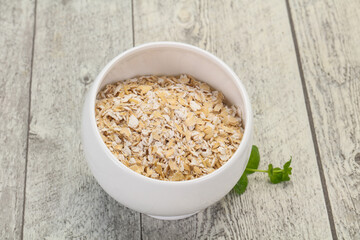 Raw oats in the bowl