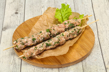 Raw minced pork skewer kebab for grill