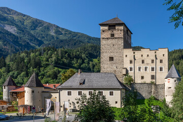 Fototapeta na wymiar Landeck Castle, the emblem of the city of Landeck, Austria, is located on a steep rock spur in the Upper Inntal valley