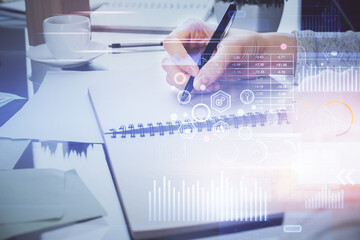 Fototapeta premium Double exposure of writing hand on background with data solution technology hologram. Ai concept.