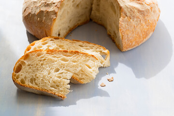 Galicia wheat  bread with slices , in galician languaje named bolo , focus in foreground