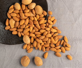 Heap of Raw Almonds on Rustic Background Closeup