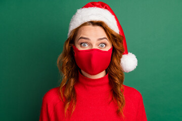 Photo of redhead young girl staring camera wear red mask pullover x-mas headwear isolated green...