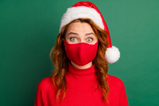 Photo of redhead young girl staring camera wear red mask pullover x-mas headwear isolated green color background