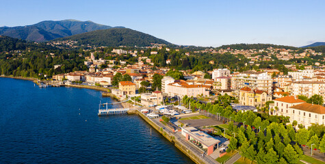 View from drone of summer Luino cityscape and Lake Maggiore, province of Varese, Lombardy, northern Italy