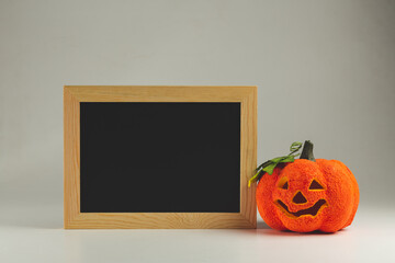 Empty Chalkboard for text and fake Curved pumpkin - halloween background