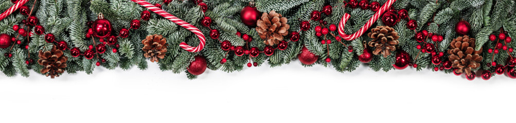 Christmas fir and decorations on white