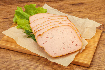 Boiled pork sausage over board